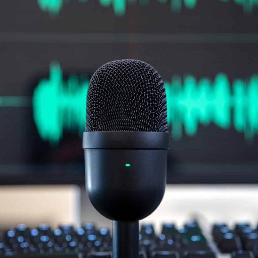 Condenser microphone, blur console and turquoise waveform background